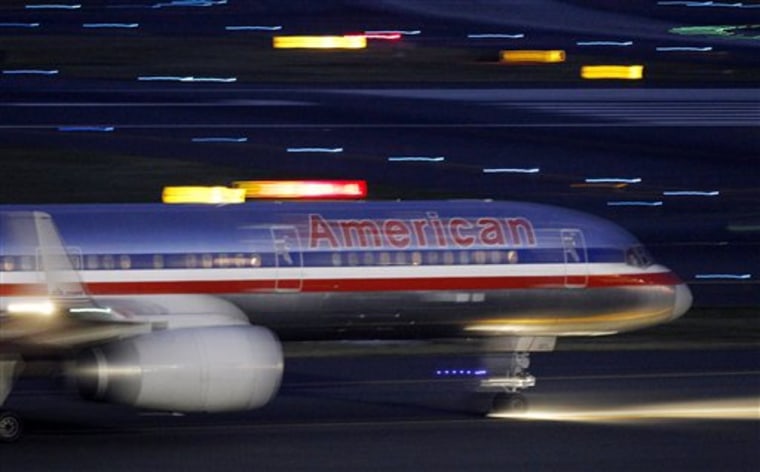 An American Airlines jet taxis on a runway as it takes off at Logan International Airport in Boston. 
